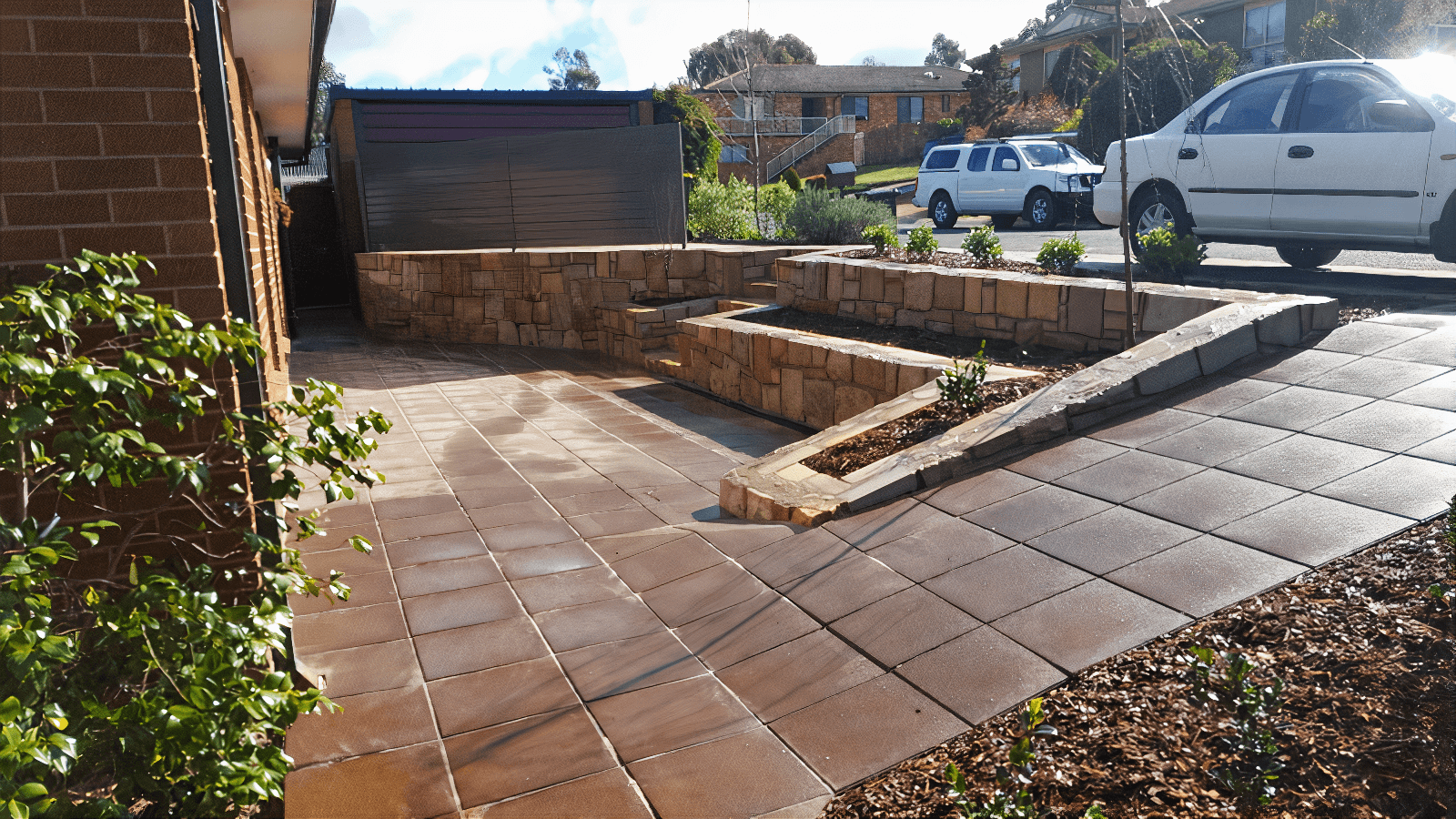 Multi-colour concreting for a child play area by Dan and Dan Landscaping